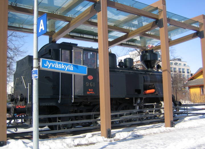 An old 0-8-0 Steamer sits under a glass roof near the staton at  Jyväskylä 