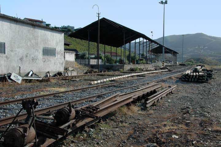 Spare ties, rail, and sheds,  Pocinho, along the Douro River, Portugal